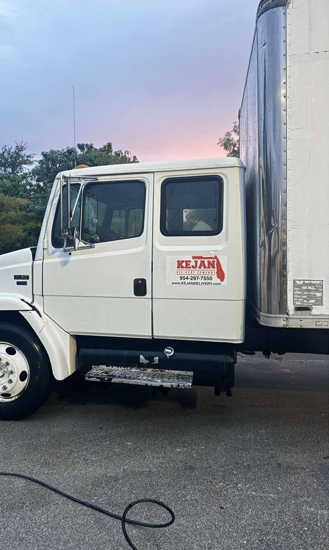 Kejan Delivery box truck with the company logo on the door